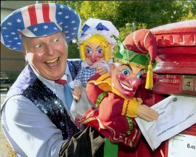 Martin Scott Price with his Punch and Judy puppets posting a letter