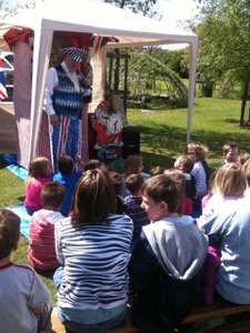 Martin Scott Price performing magic with Punch and Judy