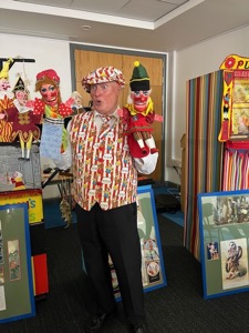 Martin Scott Price performing magic with Punch and Judy